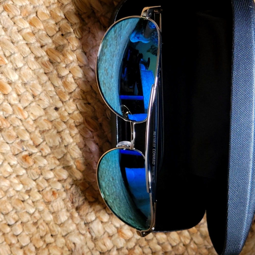 Revo brand new chrome blue lenses. Perfect condition never worn. Polarized